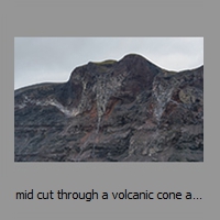 mid cut through a volcanic cone above NE coast